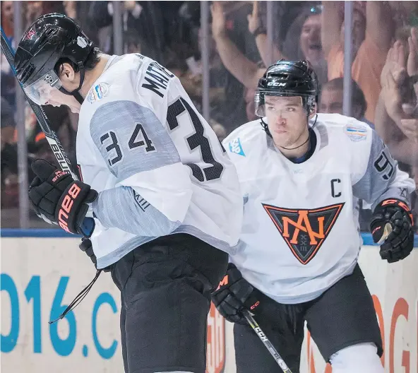  ?? — THE CANADIAN PRESS FILES ?? Auston Matthews and Connor McDavid played together for Team North America at Toronto’s Air Canada Centre during the World Cup of Hockey in September. Now the two will be opponents on the same profession­al ice surface Tuesday in Toronto.