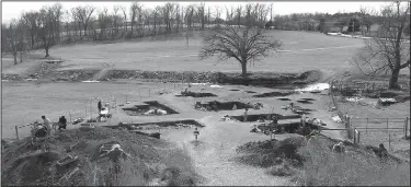  ?? Courtesy photo ?? When the city of Fayettevil­le decided to expand Rupple Road, initial tests revealed a significan­t archeologi­cal site. Flat Earth Archeologi­sts worked from October to March to fully excavate about a quarter mile of land along Hamestring Creek.