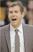  ?? STAFF FILE PHOTO BY STUART CAHILL ?? NOT GOING GREEN: Brad Stevens says he has no intention of leaving the Celtics to take over at Indiana University.