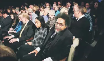  ??  ?? Philosophe­r Cornel West (centre) waits for the beginning of a presidenti­al debate sponsored by CBS at Drake University in Des Moines, Iowa. — AFP photo