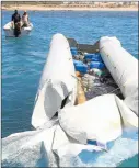  ?? Picture: AFP ?? SAD STATISTIC: Libyan coast guards drag a deflated rubber boat carrying the bodies of migrants after the craft sank off Garabulli, 60km east of Tripoli, last week