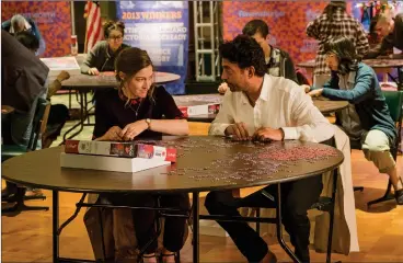  ?? Linda Kallerus/Sony Pictures Classics ?? Kelly Macdonald and Irrfan Khan portray partners in a jigsaw-puzzling competitio­n in “Puzzle.”