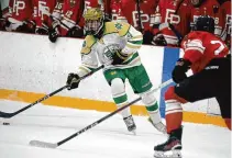  ?? Dave Phillips/For Hearst Connecticu­t Media ?? Zachary Goetze of Notre Dame looks for an open teammate during the SCC Division I hockey championsh­ip against Fairfield Prep on Friday at Bennett Rink in West Haven.