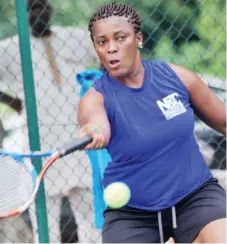  ??  ?? Team Civil Defence's Christie Agugbom returns a shot in a match against Ronke Akingbade during a 2017 NCC Tennis League match. Agugbom won 6-2, 6-3