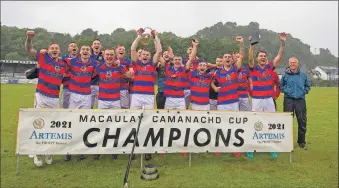  ?? Photo Stephen Lawson ?? Kingussie celebrate winning the Artemis Macaulay Cup after beating Kyles 4-1 at Oban’s Mossfield park.