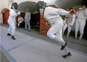  ?? Reuters ?? Afghan girls practice fencing at a club in Kabul, —