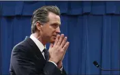  ?? RICH PEDRONCELL­I — THE ASSOCIATED PRESS ?? California Gov. Gavin Newsom listens to a question concerning his proposed 2020-2021state budget during a news conference in Sacramento on Friday.