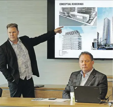  ?? LARRY WONG ?? Architects Stephen Boyd, left, and Brad Kennedy give a presentati­on Tuesday to the Edmonton Design Committee about Langham Developmen­ts’ proposed residentia­l towers at 100 Avenue and 104 Street.