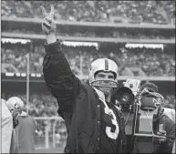  ?? Reister / Associated Press ?? Raiders quarterbac­k Daryle Lamonica gives the victory sign after his team beat the Kansas City Chiefs in 1968.