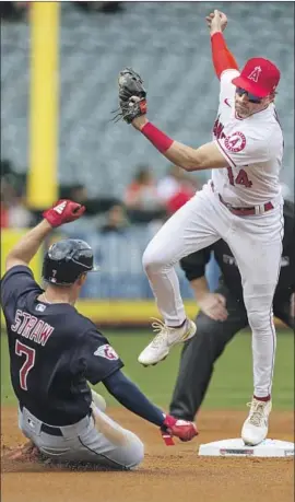  ?? Photograph­s by Alex Gallardo Associated Press ?? SECOND BASEMAN Tyler Wade, who says: “We play good defense … we do it all,” forces out Cleveland’s Myles Straw on a fielder’s choice in the first inning.