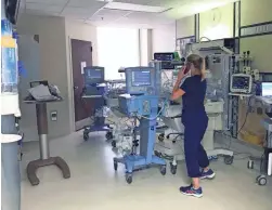  ?? MATT FELDER VIA AP ?? A medical staffer helps take care of babies who were at the hospital during Hurricane Laura on Thursday in Lake Charles, La.