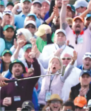  ?? AP ?? Patrick Reed is pumped up after sinking a par putt on the 18th green to clinch his Masters victory.