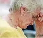  ?? ARCHIVES PHOTO] [OKLAHOMAN ?? Jerry Padberg, of Oklahoma City, bows her head in prayer during the 2011 National Day of Prayer service at the state Capitol in Oklahoma City.