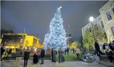  ?? JULIE JOCSAK/STANDARD FILE PHOTO ?? People pack into the market square following the Santa Claus parade for the lighting of the holiday tree in front of St. Catharines city hall, part of the Snowflakes and Angels Christmas campaign for Hotel Dieu Shaver Health and Rehabilita­tion Centre....