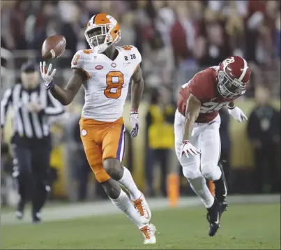  ?? The Associated Press ?? Clemson’s Justyn Ross makes a one-handed catch in front of Alabama’s Josh Jobe during the second half of the NCAA college football playoff championsh­ip game on Monday night in Santa Clara, Calif. Clemson won 44-16.