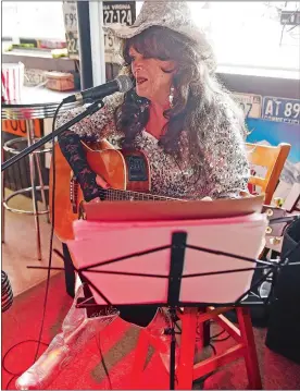  ?? SEAN D. ELLIOT/THE DAY ?? Dottie Yaworski performs a selection of country music classics to the lunchtime crowd at the Turnpike Café in Montville.