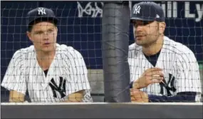  ?? KATHY WILLENS — THE ASSOCIATED PRESS ?? Newly acquired New York Yankees starting pitches Sonny Gray, left, and Jaime Garcia watch Tuesday’s game against the Detroit Tigers.