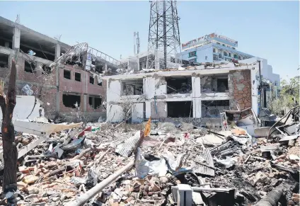  ?? Picture: EPA ?? AFTERMATH. The scene of a suicide bomb attack in Kabul, Afghanista­n, yesterday. At least 80 people were killed and more than 300 were wounded in an attack near the diplomatic district.