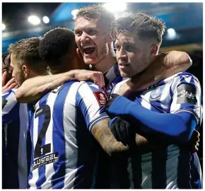  ?? GETTY IMAGES ?? Main man: scorer Windass celebrates with his team-mates