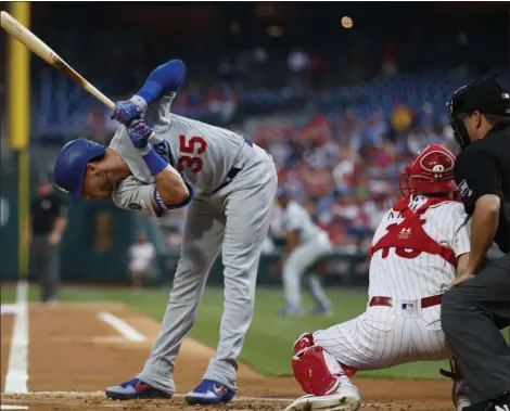  ?? MATT SLOCUM — THE ASSOCIATED PRESS ?? The Los Angeles Dodgers’ Cody Bellinger, left, dodges a pitch from Phillies starter Nick Pivetta during the first inning of a game July 17 at Citizens Bank