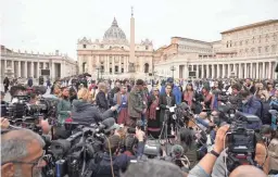  ?? GREGORIO BORGIA/AP ?? President of the Metis community, Cassidy Caron, center, speaks to the media Monday in St. Peter’s Square after meeting with Pope Francis.