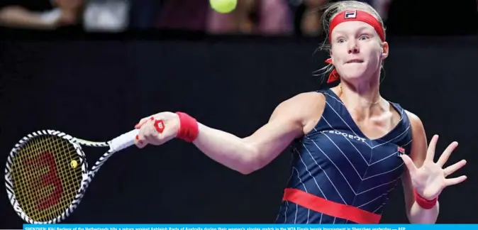  ??  ?? SHENZHEN: Kiki Bertens of the Netherland­s hits a return against Ashleigh Barty of Australia during their women’s singles match in the WTA Finals tennis tournament in Shenzhen yesterday.— AFP