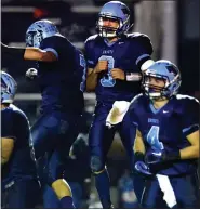  ?? MEDIANEWS GROUP FILE PHOTO ?? North Penn quarterbac­k Corey Ernst (8) celebrates with teamates after his touchdown against Pennsbury during first-half action of their playoff contest at North Penn High School on Friday November 25,2011.