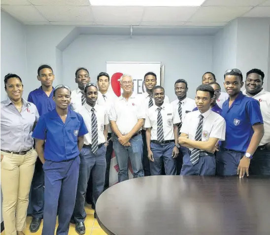  ??  ?? Members of the Jamaica College Robotics Team visit tTech. At left is Gillian Murray, marketing and human resource manager, centre is Edward ‘Teddy’ Alexander and at far right is Gavin Samuels, tTech team member and former captain of the JC Robotics team.