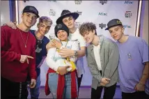  ?? CONTRIBUTE­D ?? The popular boy band Why Don’t We visited Aflac Cancer & Blood Disorders Center of Children’s Healthcare of Atlanta on Oct. 30, where they met one of their biggest fans, Savannah, who is dealing with cancer.