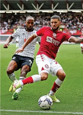  ?? ?? Nahki Wells comes under pressure from Fulham’s Denis Odoi