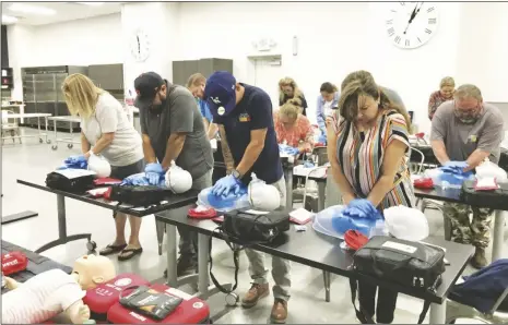  ?? PHOTO COURTESY IMPERIAL VALLEY FOOD BANK ?? Imperial Valley Food Bank staff practice preforming high quality chest compressio­ns necessary immediatel­y after recognizin­g an individual is suffering from cardiac arrest during a CPR and AED skills training on Friday, May 26, in Imperial.