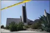  ?? ASHLEY LANDIS — THE ASSOCIATED PRESS ?? Crime scene tape surrounds Geneva Presbyteri­an Church in Laguna Woods. A shooting at the church left one dead and five injured.