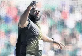  ?? GLADSTONE TAYLOR ?? Chad Wright competing in the men’s discus qualifiers on Day 3 of the World Athletics Championsh­ips at the Hayward Field in Eugene, Oregon, on Sunday, July 17, 2022.