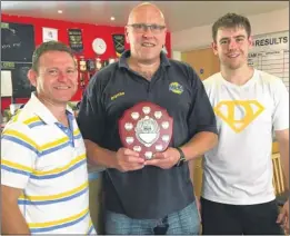  ??  ?? Kenny Stibbles and Matt Emery, captains of joint winners the Gerry Hat-tricks and the Eric Katonas, with club chairman Matt Evans, centre