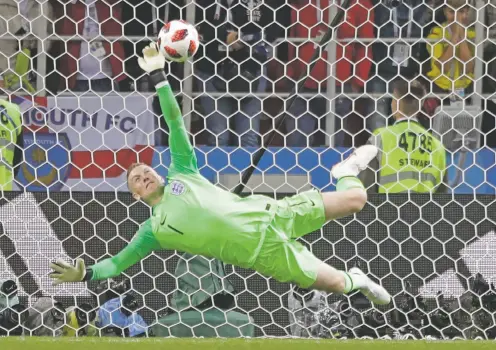  ?? MATTHIAS SCHRADER/ASSOCIATED PRESS ?? England goalkeeper Jordan Pickford saves a penalty kick Tuesday against Colombia at the World Cup in Moscow.