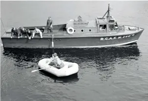  ?? PHOTO OF CRASH BOAT COURTESY RCAF VIA COMOX AIR FORCE MUSEUM; PHOTOS OF MILITARY PERSONNEL AND RESCUE AIRCRAFT COURTESY BATTLESHIP NORTH CAROLINA ?? Top down: the “crash boat” dispatched from RCAF Station Bella Bella to Calvert Island in 1942; in later years (from left) Captain Ray G. Thorpe, Commander Mac J. Roebuck and Chief Warrant OŠcer Stanley S. Goddard; airlifting the wreckage of the Kingfisher to Port Hardy, Vancouver, 22 years after the crash.