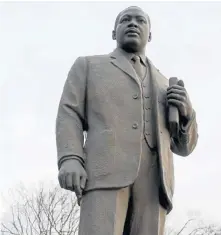  ?? TNSPHOTOS ?? STANDING TALL: A statue of Dr. Martin Luther King Jr. rises in Kelly Ingram Park in Birmingham, Ala., a hub of the civil rights movement in the 1960s.