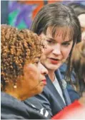  ?? STAFF PHOTO BY DOUG STRICKLAND ?? Tennessee Education Commission­er Candice McQueen, right, talks with state Rep. JoAnne Favors before addressing the Hamilton County Board of Education on Thursday. McQueen presented a partnershi­p school district plan with the goal of improving Hamilton...