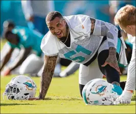  ?? ALLEN EYESTONE / THE PALM BEACH POST ?? Former Dolphins center Mike Pouncey is saying he learned that he was being released when the team informed his agent by text message.