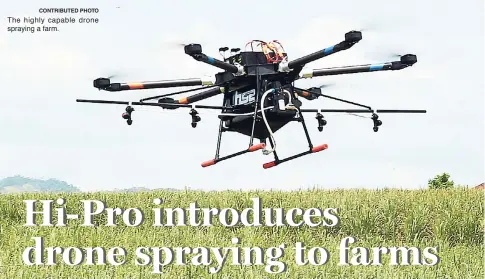  ?? CONTRIBUTE­D PHOTO ?? The highly capable drone spraying a farm.