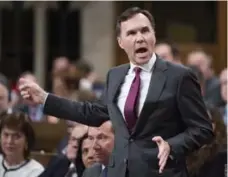  ?? ADRIAN WYLD/THE CANADIAN PRESS ?? “I did not at any point in time . . . discuss any confidenti­al informatio­n with my father or with anyone else,” Finance Minister Bill Morneau insisted.