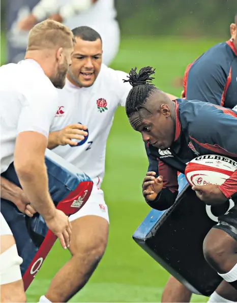  ??  ?? No holds barred: Maro Itoje prepares for the expected fierce challenge against Wales as he charges with the ball during the England captain’s run at Clifton College in Bristol yesterday