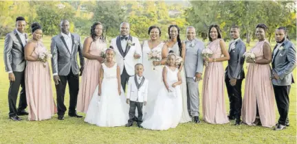  ??  ?? Zolia and Clayton pose with the full complement of their bridal party for a post-nuptials photo: (From left) groom’s nephew Damaro Robinson, bride’s cousin Nishauna Downer, Vaughn Walsh, groom’s sister Duedrops Brown, maid of honour and bride’s sister Kaylia Harrison, best man and groom’s brother Damien Brown, Sharilynn Wright, groom’s nephew Franz Williams, bride’s sister Tavanna Harrison, bride’s cousin Cason Henlon. (Front row) Flower girls Alianna Arnett (left) and T’aeja Anson, and ring bearer Khymani Stewart.