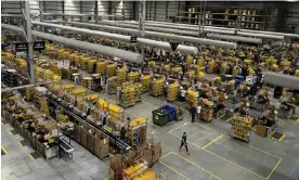  ?? Daniel Leal-Olivas/AFP/Getty Images ?? Preparatio­ns at the Amazon warehouse in Peterborou­gh for Black Friday in 2019. Photograph: