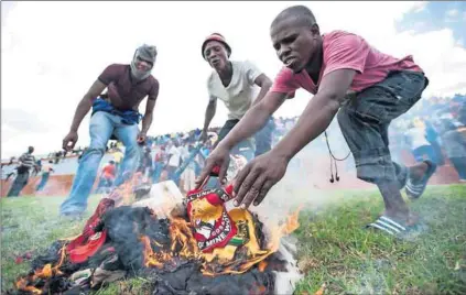  ?? Photo: Delwyn Verasamy ?? Countdown: Mineworker­s in Rustenburg burned NUM merchandis­e during the wage talks and strike that led up to the Marikana debacle, because they ‘felt let down’ by the union.