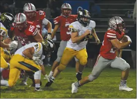  ?? CHUCK RIDENOUR/SDG Newspapers ?? Shelby’s Owen Fisher gets into the open after burst through a hole created by his offensive linemen during Friday’s win against River Valley.