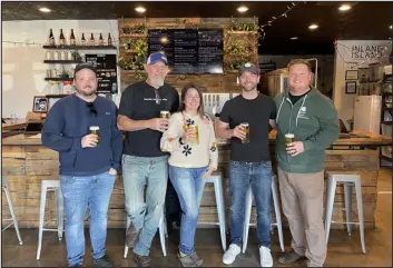  ?? PHOTO PROVIDED BY KEVIN LIND ?? The new owners of Baere Brewing include (from left to right) Jonah Munson, Leslie Munson, Adam Novinska and Kevin Lind.