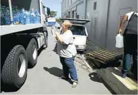  ?? Picture: SUPPLIED ?? PRECIOUS CARGO: Talita van der Heever loads water that was donated by East London residents during the water crisis in Cape Town