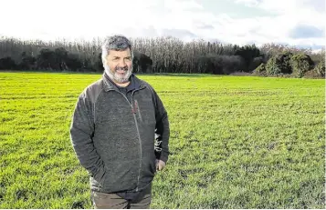  ?? Photo: Damien Eagers ?? Tom in a field of winter barley