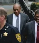  ?? MEL EVANS/ AP ?? Bill Cosby ( center) leaves hearings for jury selection in his sexual assault retrial.
